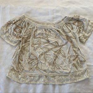 Lucky Brand medium loose fitting top with tan embroidered floral design. medium